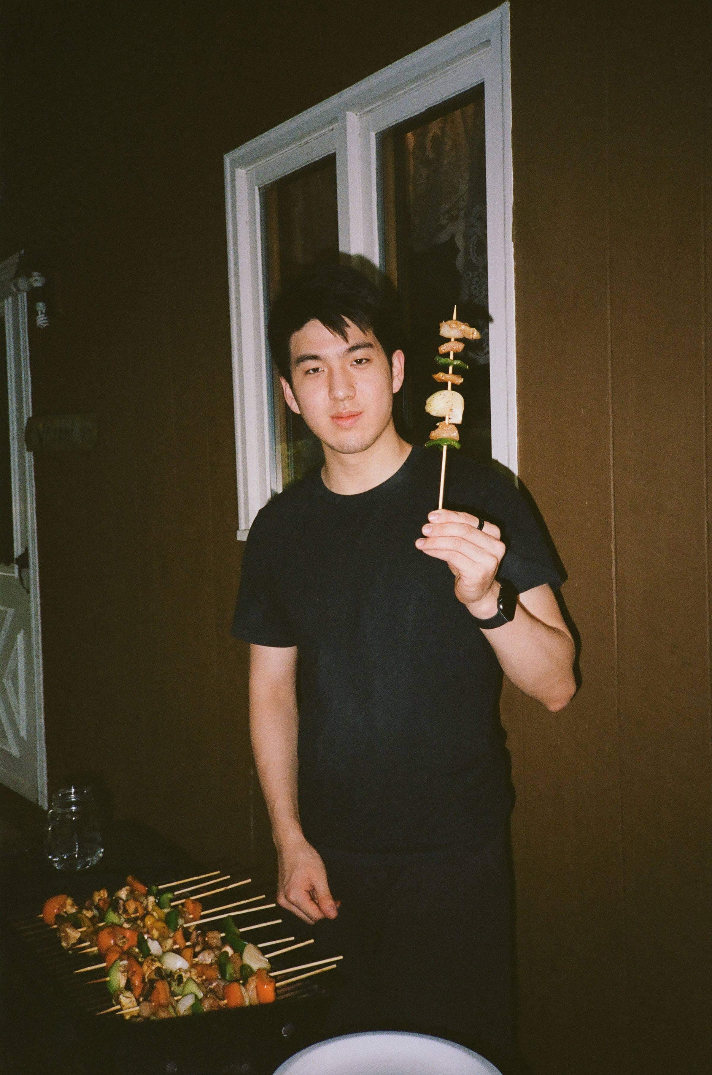 Taco holding a skewer